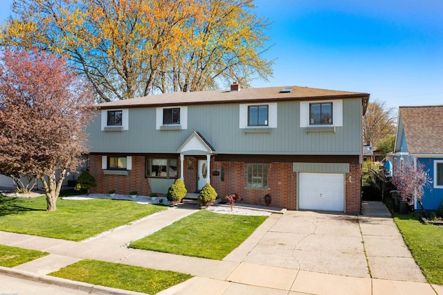 view of front of home with a front lawn, brick siding, a garage, a chimney, and concrete driveway