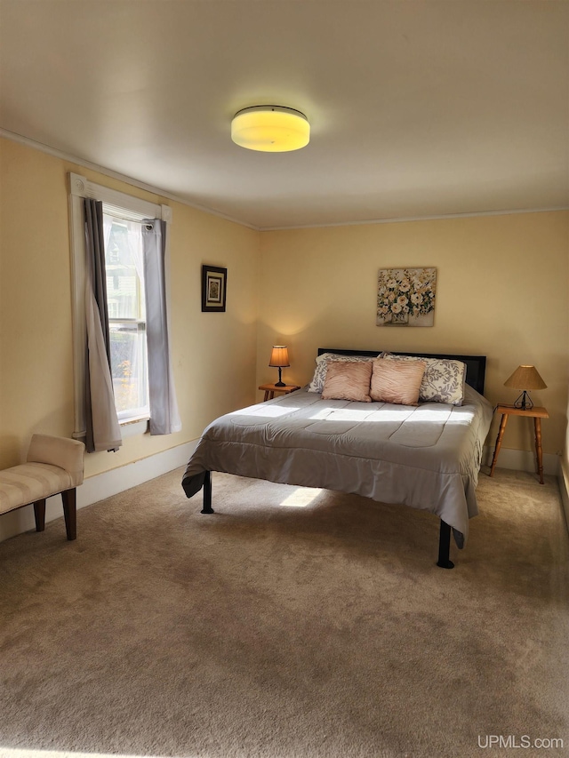 bedroom with carpet floors and ornamental molding