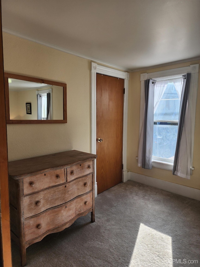 unfurnished bedroom with carpet flooring