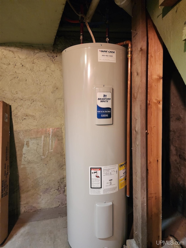 utility room featuring electric water heater