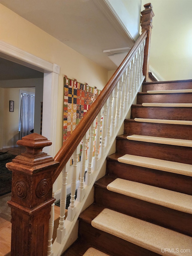 stairway with wood finished floors