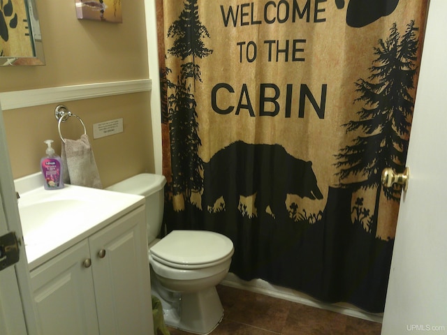 full bath featuring toilet, tile patterned floors, a shower with curtain, and vanity