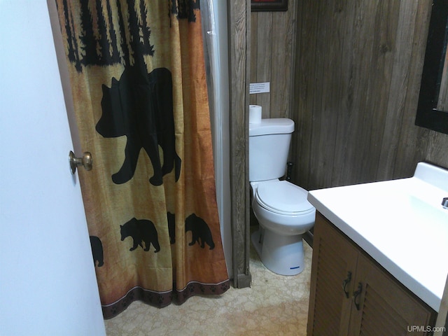 bathroom featuring toilet and vanity