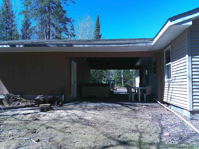 view of parking with a carport