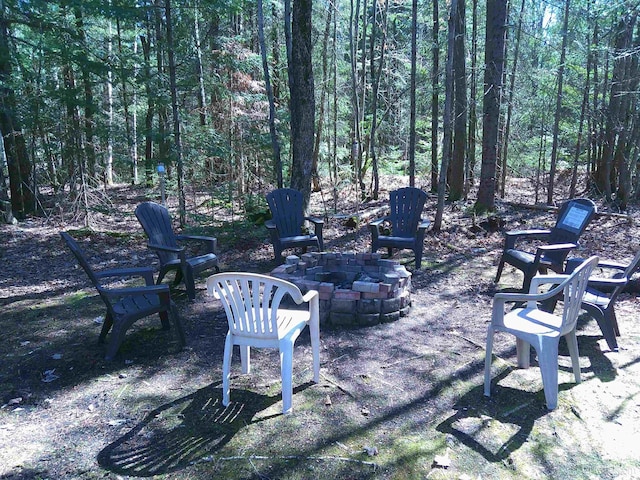 view of yard with a fire pit