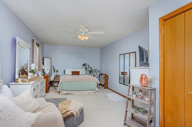 carpeted bedroom featuring a ceiling fan