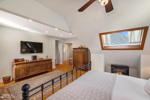 bedroom with recessed lighting, baseboards, wood finished floors, and lofted ceiling