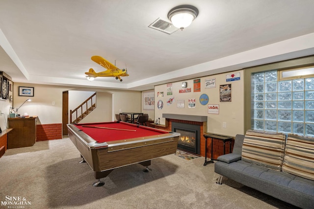 rec room featuring carpet floors, visible vents, billiards, and a brick fireplace