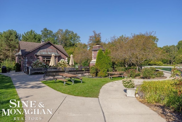 view of property's community with a yard