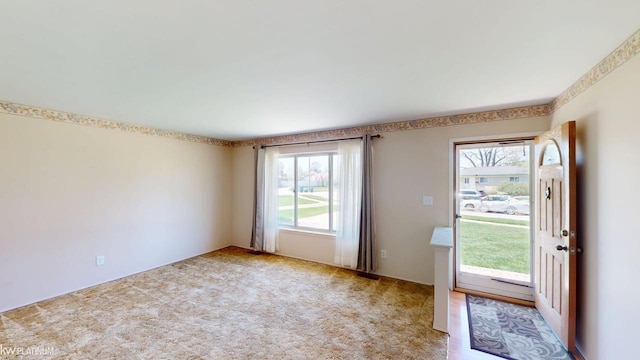 doorway featuring carpet floors
