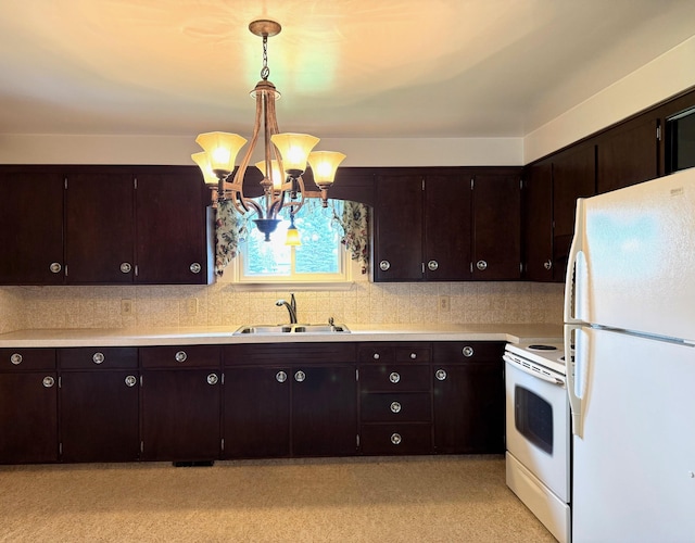 kitchen featuring dark brown cabinets, a notable chandelier, a sink, white appliances, and light countertops