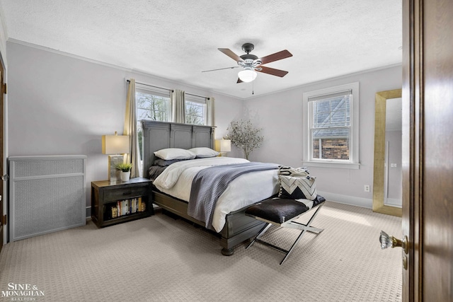 bedroom with a textured ceiling, crown molding, baseboards, radiator heating unit, and carpet flooring