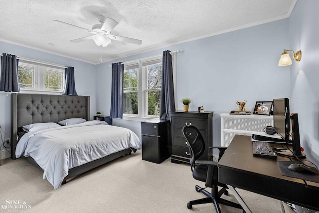 bedroom with crown molding, a ceiling fan, a textured ceiling, and carpet