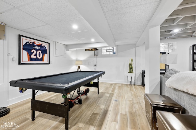 game room featuring baseboards, pool table, a paneled ceiling, and light wood-style flooring
