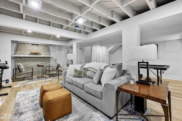 living area with baseboards and hardwood / wood-style flooring