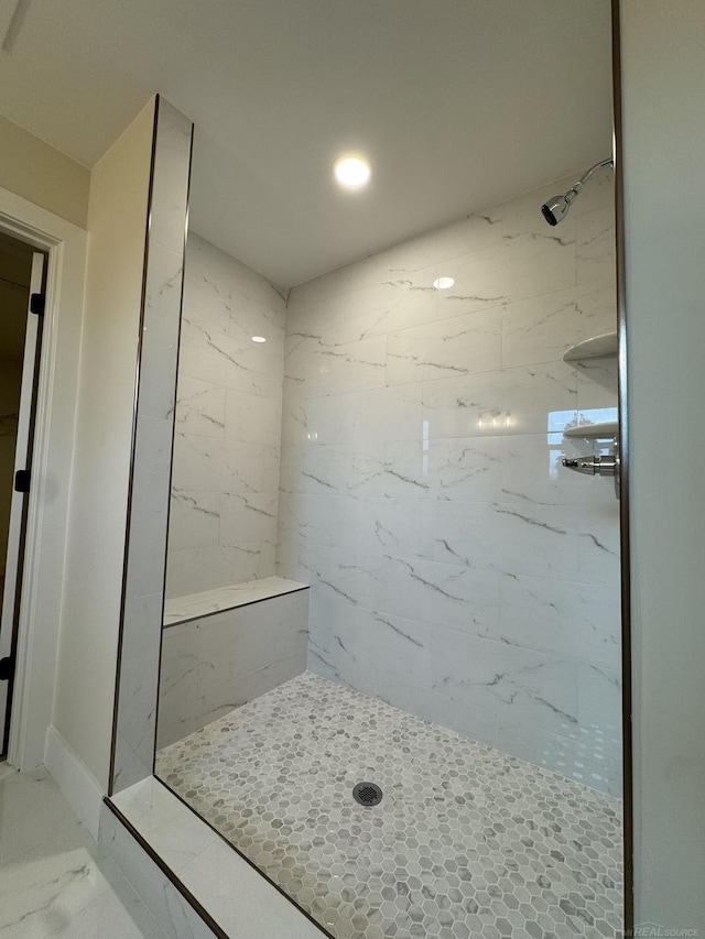 full bathroom with a shower, marble finish floor, and recessed lighting