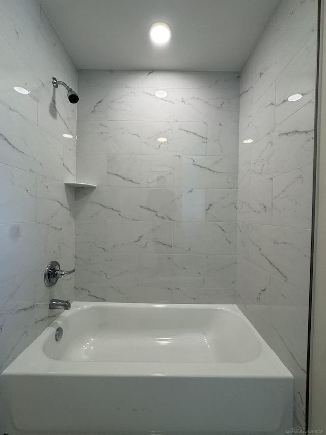 bathroom with shower / tub combination