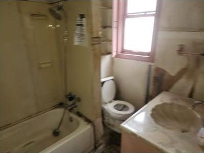 full bath with vanity, shower / bathtub combination, and toilet