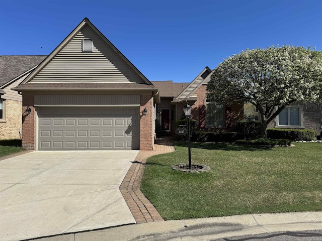 view of front of property featuring brick siding, a garage, driveway, and a front lawn