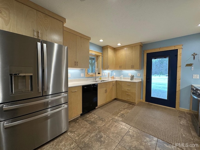 kitchen with light brown cabinetry, a sink, stainless steel fridge with ice dispenser, light countertops, and black dishwasher