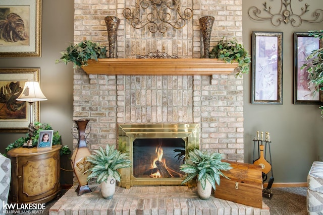 carpeted living room with a fireplace