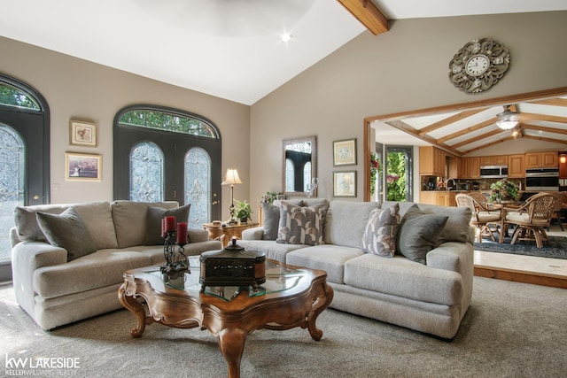 living room with high vaulted ceiling, plenty of natural light, carpet flooring, and beam ceiling