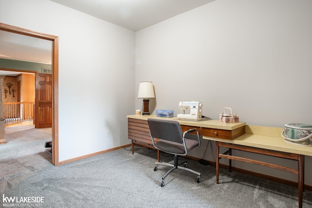 carpeted office featuring baseboards and visible vents