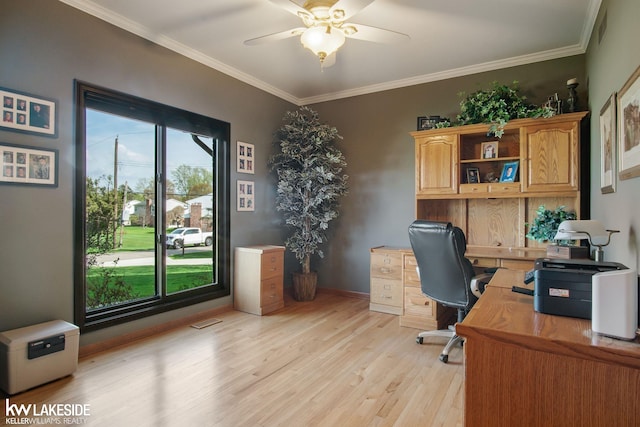 office area featuring ornamental molding, a ceiling fan, light wood finished floors, and visible vents
