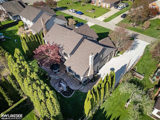 birds eye view of property with a residential view