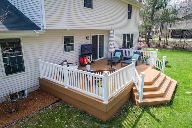 wooden terrace featuring a yard