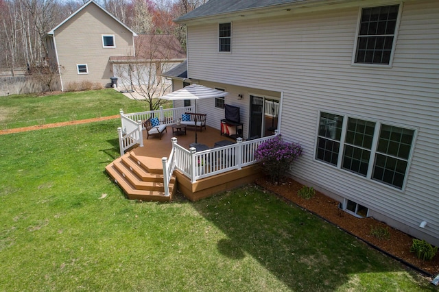rear view of property with a wooden deck, a yard, and outdoor lounge area