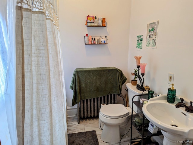 bathroom with toilet and a sink