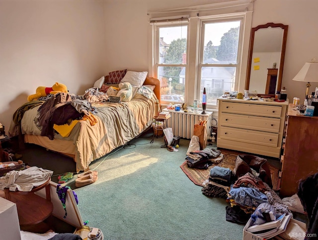 bedroom with carpet flooring and radiator