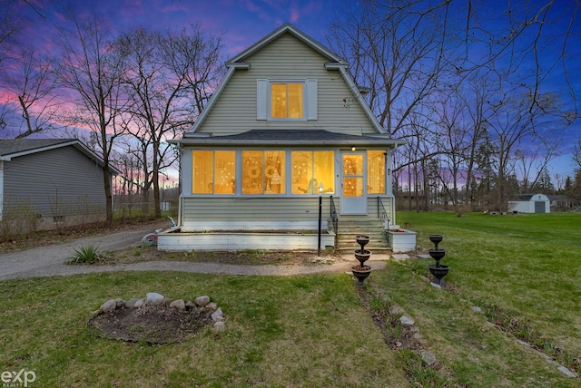 dutch colonial with a sunroom and a front lawn