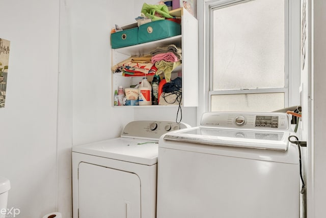 washroom featuring independent washer and dryer and laundry area