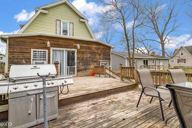 wooden terrace featuring area for grilling