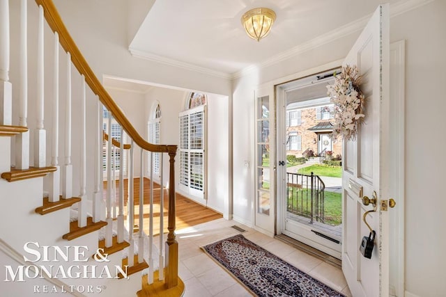 926 Lochmoor Pl, Grosse Pointe Woods, MI 48236 - foyer entrance with light tile patterned floors, crown molding, and stairs