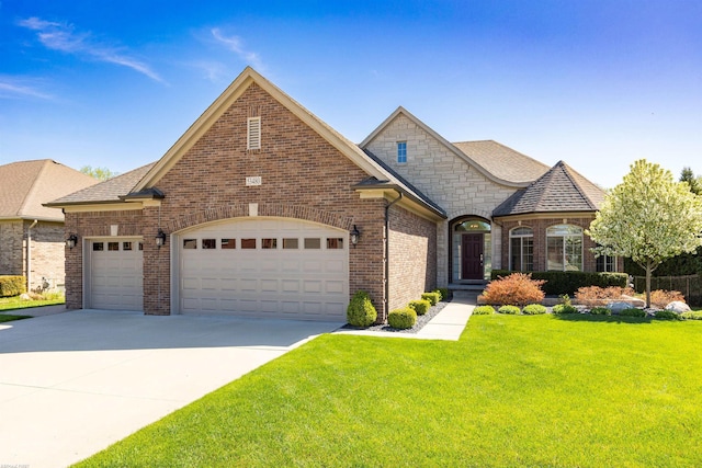 view of front facade with brick siding, a garage, a front lawn, and driveway
