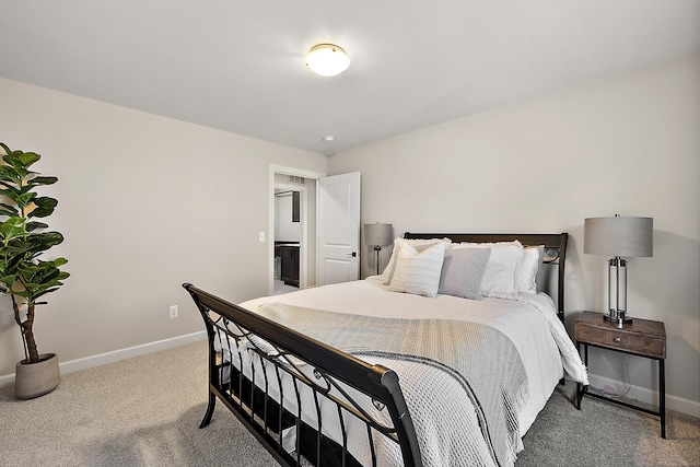 carpeted bedroom with baseboards