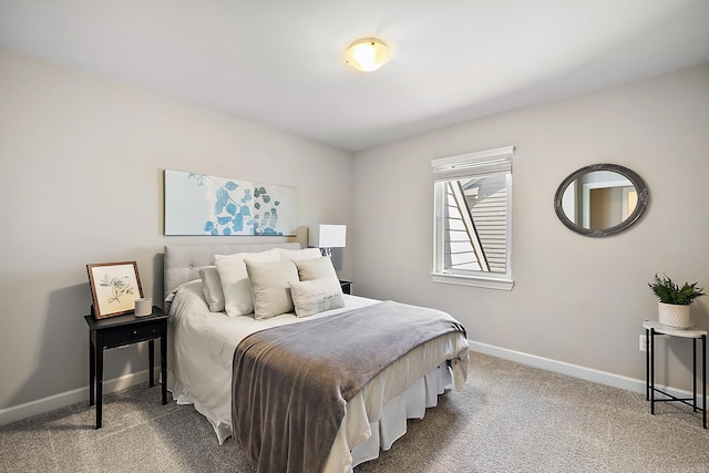 carpeted bedroom with baseboards