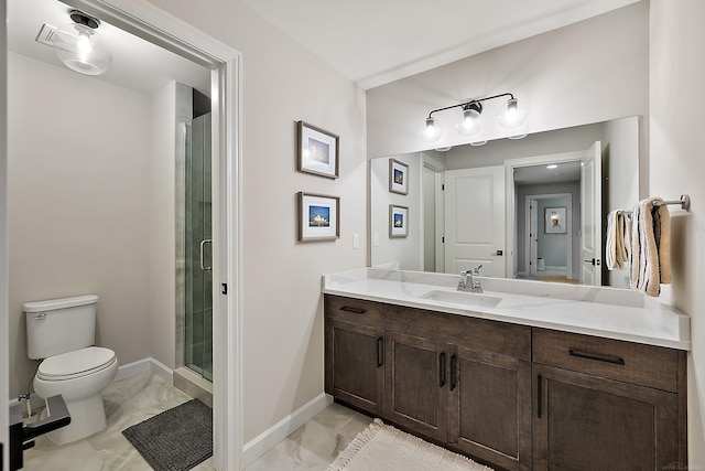 full bath featuring vanity, toilet, marble finish floor, baseboards, and a shower stall