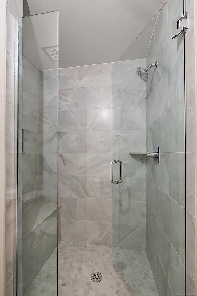 full bath featuring a shower stall