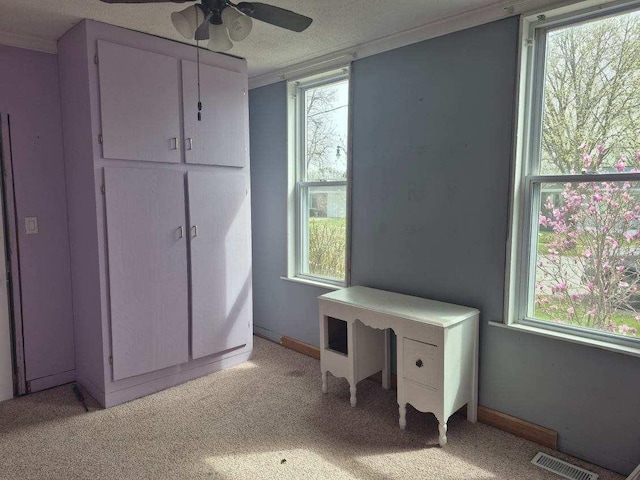 bedroom featuring light colored carpet and visible vents