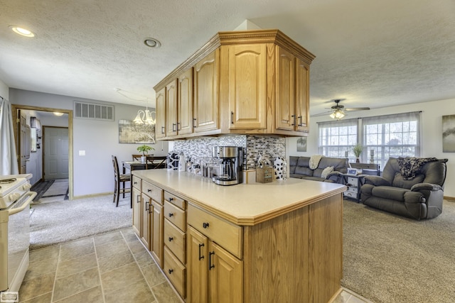 8765 Winn Rd, Brown City, MI 48416 - kitchen with a textured ceiling, visible vents, white gas range oven, ceiling fan with notable chandelier, and light carpet