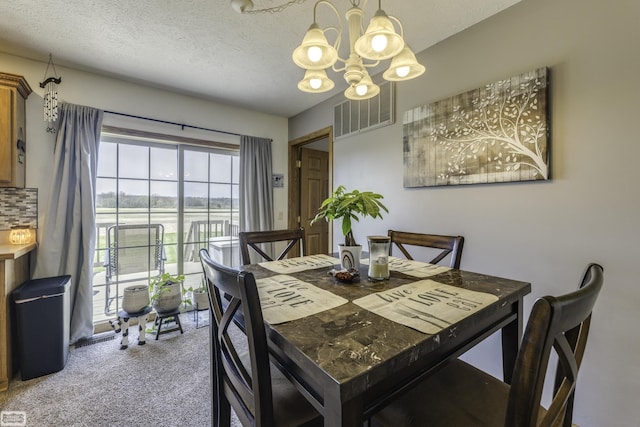8765 Winn Rd, Brown City, MI 48416 - dining room featuring carpet floors, a textured ceiling, an inviting chandelier, and visible vents