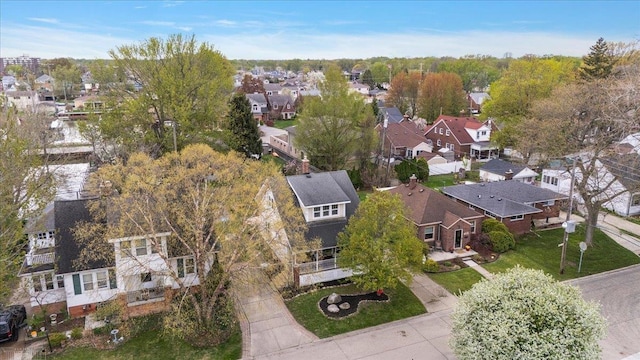 birds eye view of property with a residential view