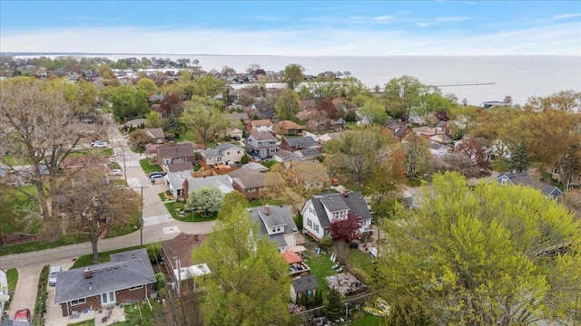 bird's eye view featuring a water view and a residential view