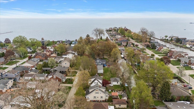 bird's eye view with a residential view and a water view
