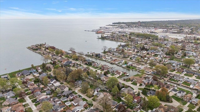 birds eye view of property featuring a water view and a residential view