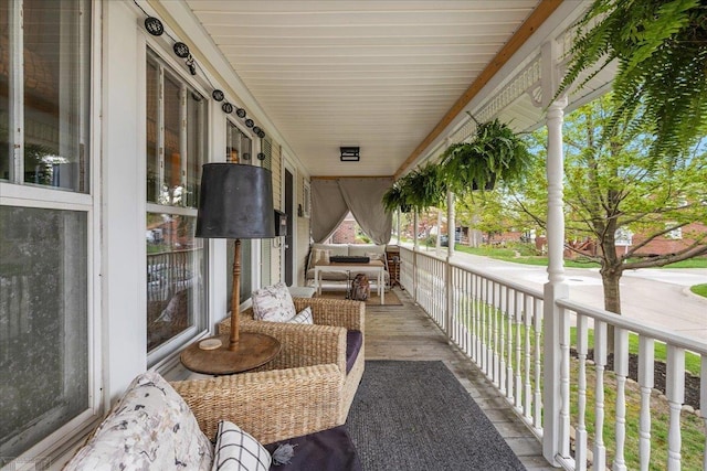 balcony featuring a porch
